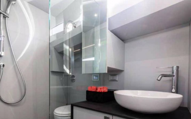 Bathroom with shower, toilet and sink